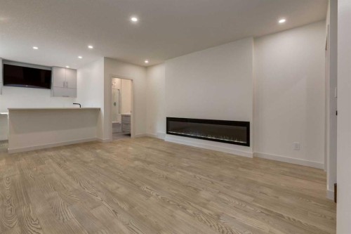 439 Canals Boulevard Sw, Airdrie, AB - Indoor Photo Showing Other Room With Fireplace