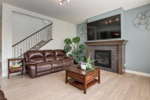 439 Canals Boulevard Sw, Airdrie, AB - Indoor Photo Showing Living Room With Fireplace