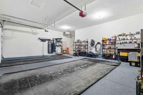 711 Mandalay Link, Carstairs, AB - Indoor Photo Showing Garage