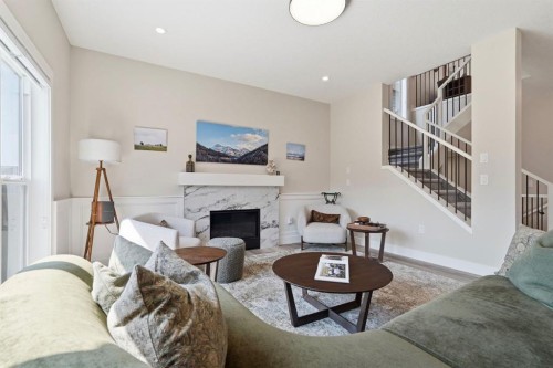 711 Mandalay Link, Carstairs, AB - Indoor Photo Showing Living Room With Fireplace