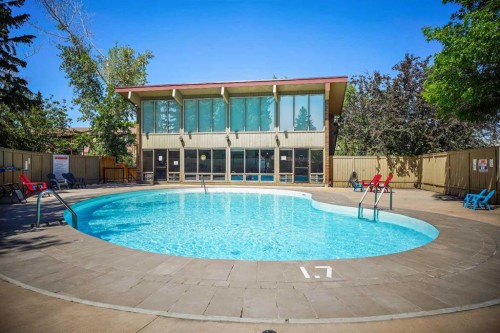 602-8948 Elbow Drive Sw, Calgary, AB - Outdoor With In Ground Pool With Backyard