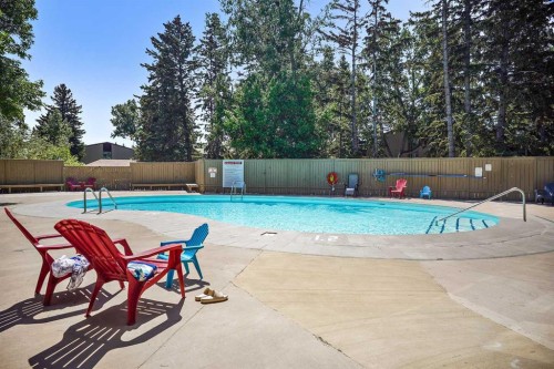 602-8948 Elbow Drive Sw, Calgary, AB - Outdoor With In Ground Pool With Backyard