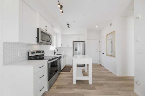 3104-3727 Sage Hill Drive Nw, Calgary, AB - Indoor Photo Showing Kitchen With Stainless Steel Kitchen With Upgraded Kitchen