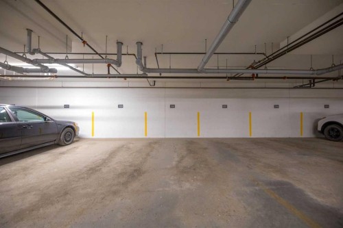 3104-3727 Sage Hill Drive Nw, Calgary, AB - Indoor Photo Showing Garage