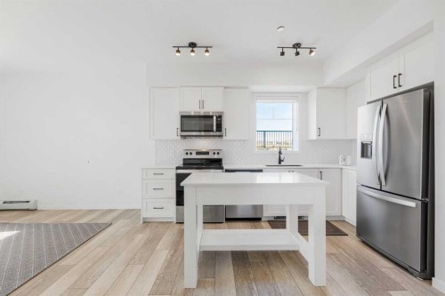 3104-3727 Sage Hill Drive Nw, Calgary, AB - Indoor Photo Showing Kitchen With Stainless Steel Kitchen With Upgraded Kitchen