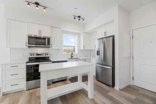 3104-3727 Sage Hill Drive Nw, Calgary, AB - Indoor Photo Showing Kitchen With Stainless Steel Kitchen With Upgraded Kitchen