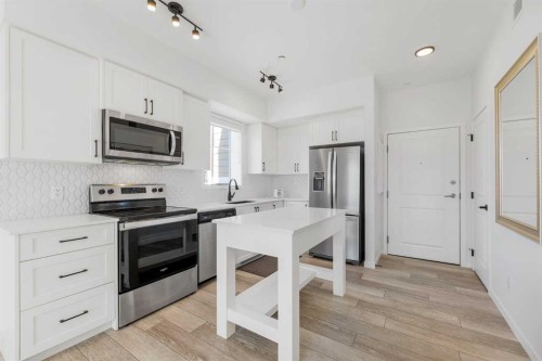 3104-3727 Sage Hill Drive Nw, Calgary, AB - Indoor Photo Showing Kitchen With Stainless Steel Kitchen With Upgraded Kitchen