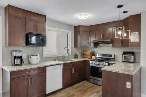 44 Strathclair Rise Sw, Calgary, AB - Indoor Photo Showing Kitchen With Stainless Steel Kitchen