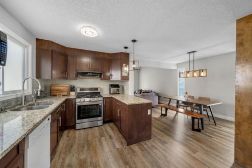 44 Strathclair Rise Sw, Calgary, AB - Indoor Photo Showing Kitchen With Stainless Steel Kitchen With Double Sink