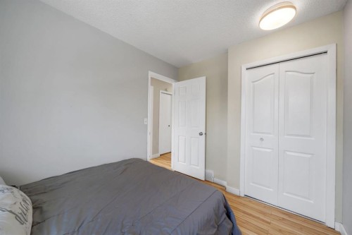 44 Strathclair Rise Sw, Calgary, AB - Indoor Photo Showing Bedroom