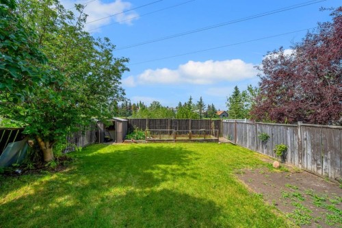44 Strathclair Rise Sw, Calgary, AB - Outdoor With Backyard