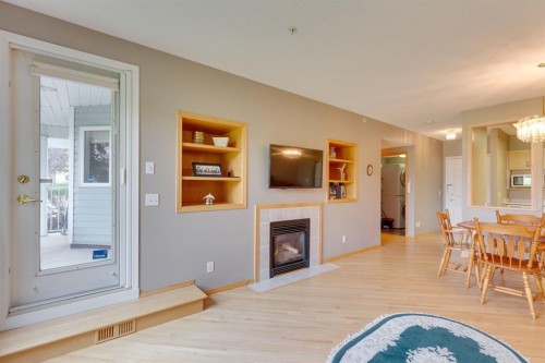 3109-3109 Hawksbrow Point Nw, Calgary, AB - Indoor With Fireplace