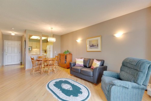 3109-3109 Hawksbrow Point Nw, Calgary, AB - Indoor Photo Showing Living Room