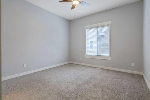 22 West Coach Manor Sw, Calgary, AB - Indoor Photo Showing Other Room