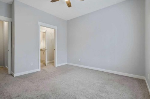 22 West Coach Manor Sw, Calgary, AB - Indoor Photo Showing Other Room