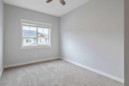 22 West Coach Manor Sw, Calgary, AB - Indoor Photo Showing Other Room
