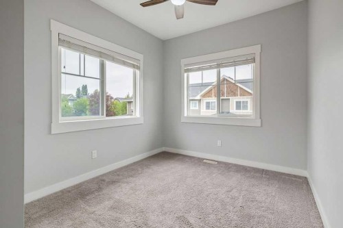 22 West Coach Manor Sw, Calgary, AB - Indoor Photo Showing Other Room