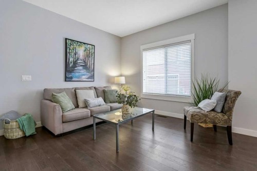 22 West Coach Manor Sw, Calgary, AB - Indoor Photo Showing Living Room