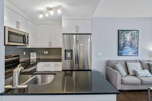 22 West Coach Manor Sw, Calgary, AB - Indoor Photo Showing Kitchen With Stainless Steel Kitchen With Double Sink