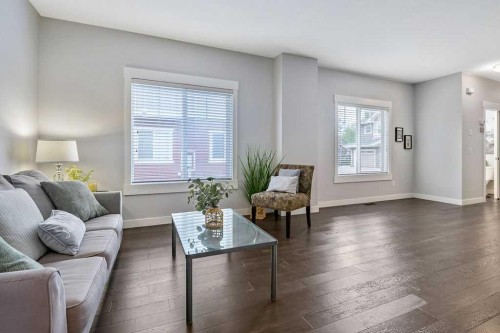 22 West Coach Manor Sw, Calgary, AB - Indoor Photo Showing Living Room