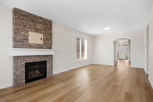 596 Windbrook Heights, Airdrie, AB - Indoor Photo Showing Living Room With Fireplace