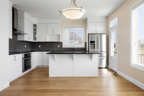 596 Windbrook Heights, Airdrie, AB - Indoor Photo Showing Kitchen With Upgraded Kitchen