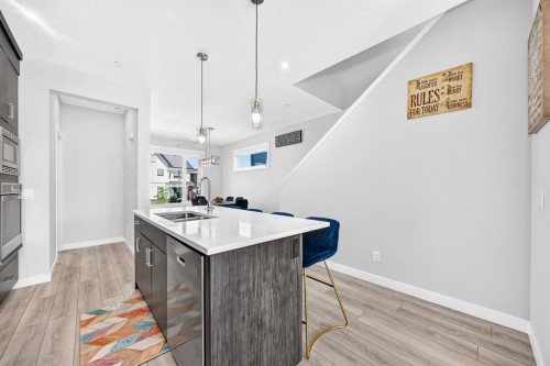 129 Calhoun Common Ne, Calgary, AB - Indoor Photo Showing Kitchen With Double Sink With Upgraded Kitchen