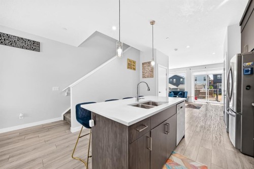 129 Calhoun Common Ne, Calgary, AB - Indoor Photo Showing Kitchen With Double Sink With Upgraded Kitchen