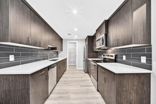 129 Calhoun Common Ne, Calgary, AB - Indoor Photo Showing Kitchen With Upgraded Kitchen