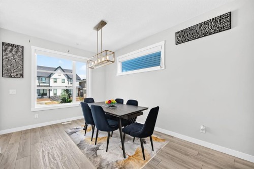 129 Calhoun Common Ne, Calgary, AB - Indoor Photo Showing Dining Room