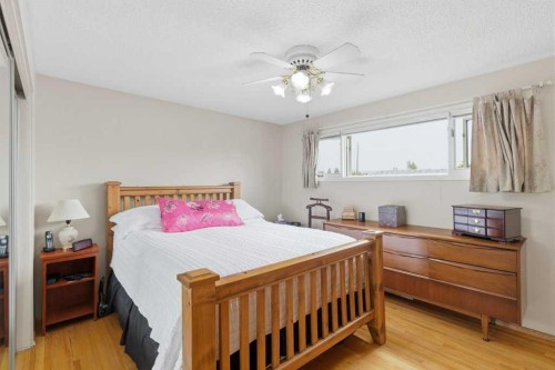 9511 Academy Drive Se, Calgary, AB - Indoor Photo Showing Bedroom