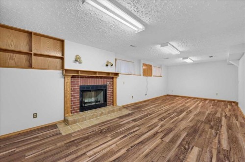273 Sandarac Drive Nw, Calgary, AB - Indoor With Fireplace