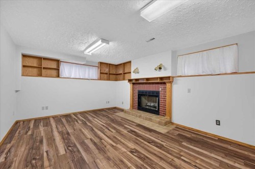 273 Sandarac Drive Nw, Calgary, AB - Indoor With Fireplace