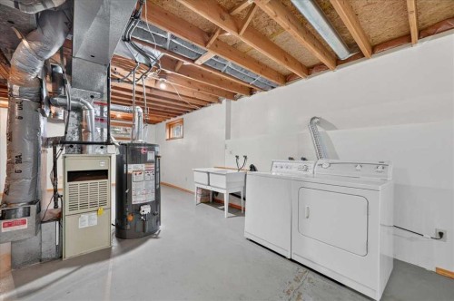 273 Sandarac Drive Nw, Calgary, AB - Indoor Photo Showing Laundry Room