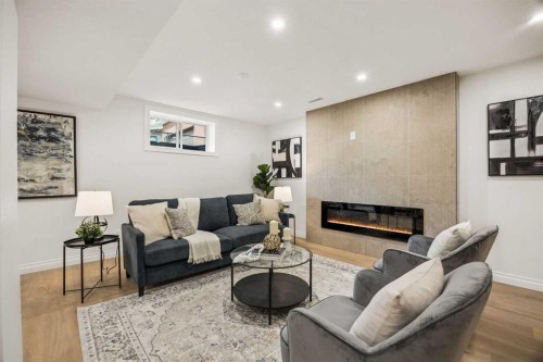 156 Strathridge Place Sw, Calgary, AB - Indoor Photo Showing Living Room With Fireplace