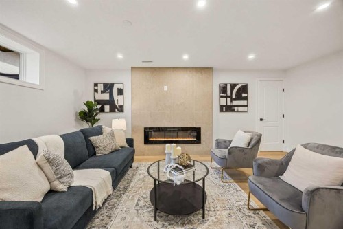 156 Strathridge Place Sw, Calgary, AB - Indoor Photo Showing Living Room With Fireplace