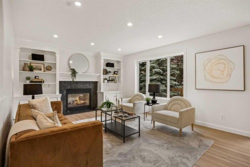 156 Strathridge Place Sw, Calgary, AB - Indoor Photo Showing Living Room With Fireplace