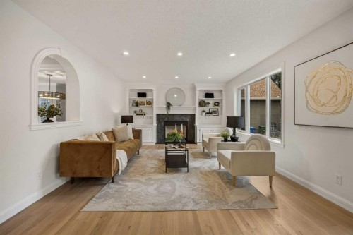 156 Strathridge Place Sw, Calgary, AB - Indoor Photo Showing Living Room With Fireplace