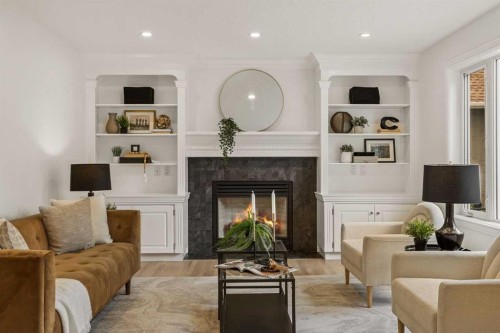 156 Strathridge Place Sw, Calgary, AB - Indoor Photo Showing Living Room With Fireplace