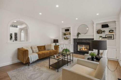156 Strathridge Place Sw, Calgary, AB - Indoor Photo Showing Living Room With Fireplace