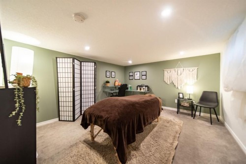 2 Elk Avenue, Okotoks, AB - Indoor Photo Showing Bedroom