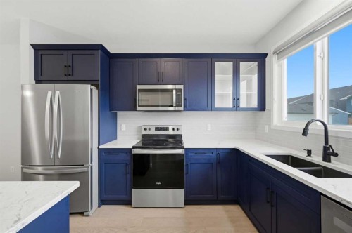 156 Seton Villas Se, Calgary, AB - Indoor Photo Showing Kitchen With Double Sink With Upgraded Kitchen