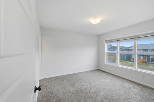 156 Seton Villas Se, Calgary, AB - Indoor Photo Showing Other Room