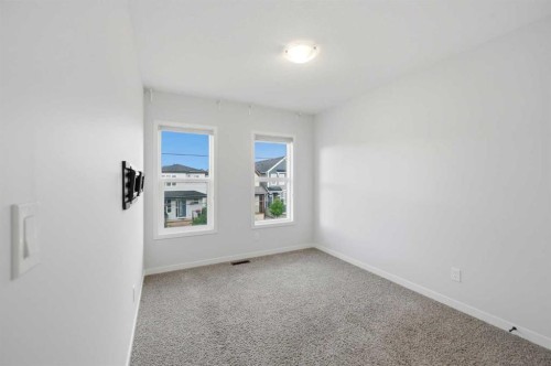 156 Seton Villas Se, Calgary, AB - Indoor Photo Showing Other Room