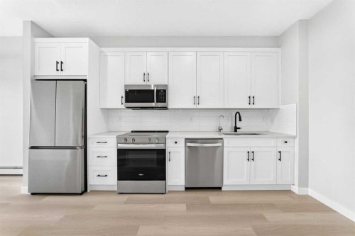 1409-3700 Seton Avenue Se, Calgary, AB - Indoor Photo Showing Kitchen