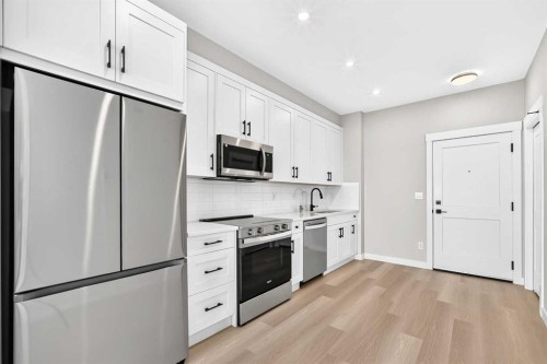 1409-3700 Seton Avenue Se, Calgary, AB - Indoor Photo Showing Kitchen