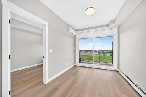 1409-3700 Seton Avenue Se, Calgary, AB - Indoor Photo Showing Other Room