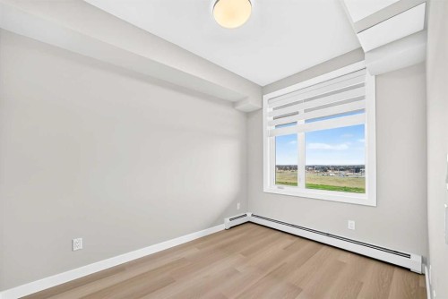 1409-3700 Seton Avenue Se, Calgary, AB - Indoor Photo Showing Other Room