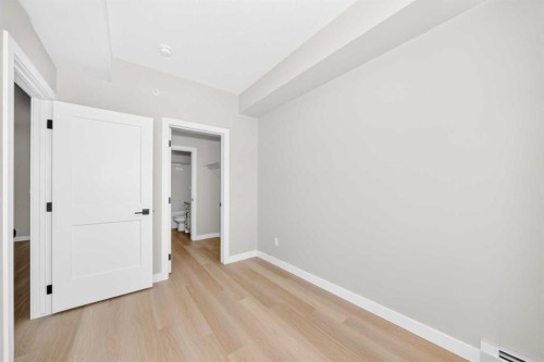 1409-3700 Seton Avenue Se, Calgary, AB - Indoor Photo Showing Other Room
