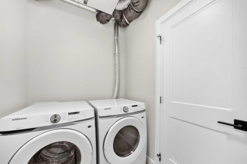 1409-3700 Seton Avenue Se, Calgary, AB - Indoor Photo Showing Laundry Room